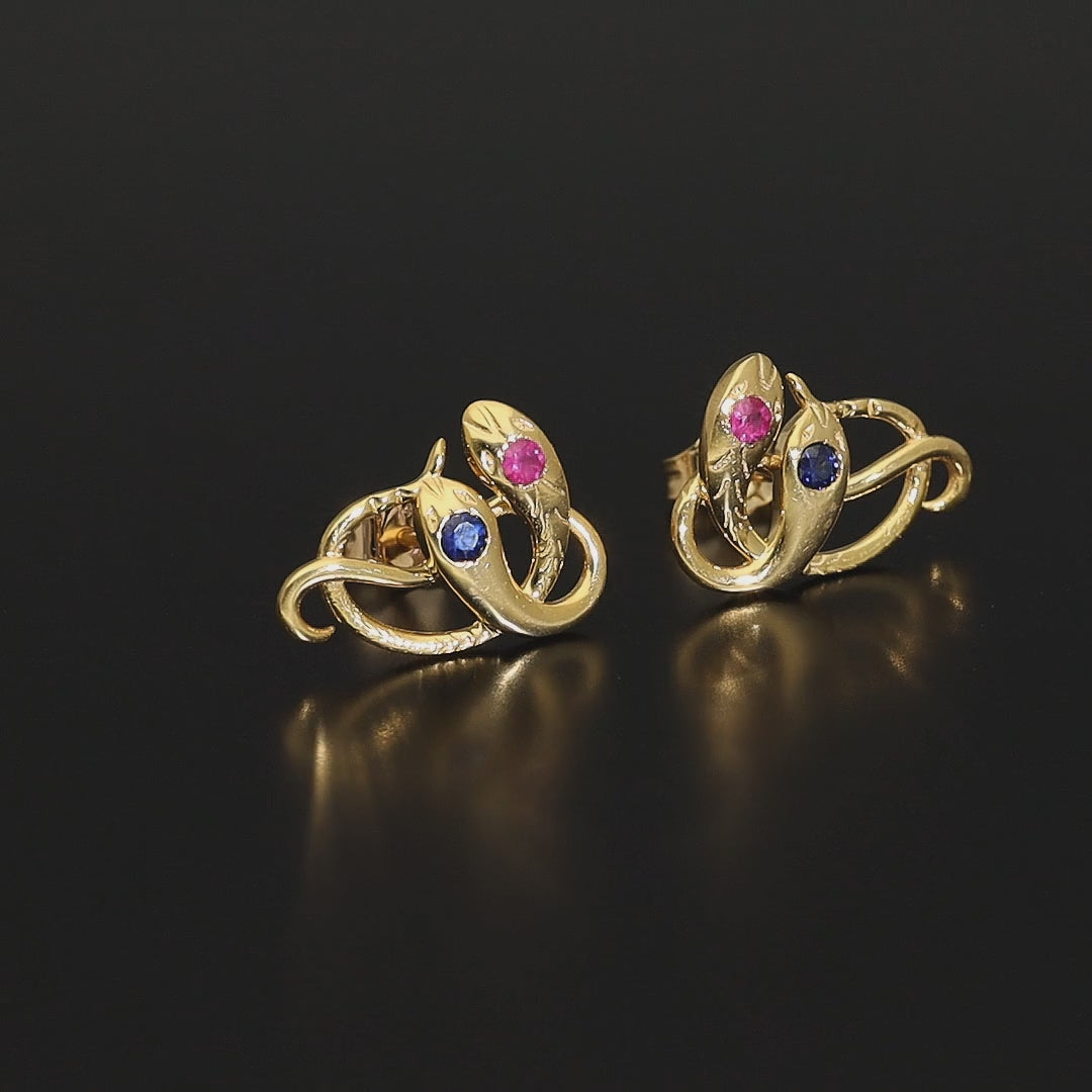 Victorian revival double headed snake studs. Made of solid rose or yellow gold with natural rubies and sapphires. Unique artisan stud earrings. Handmade of solid gold. Perfect gift idea for her! Journey Jewellery online design jewelry shop.