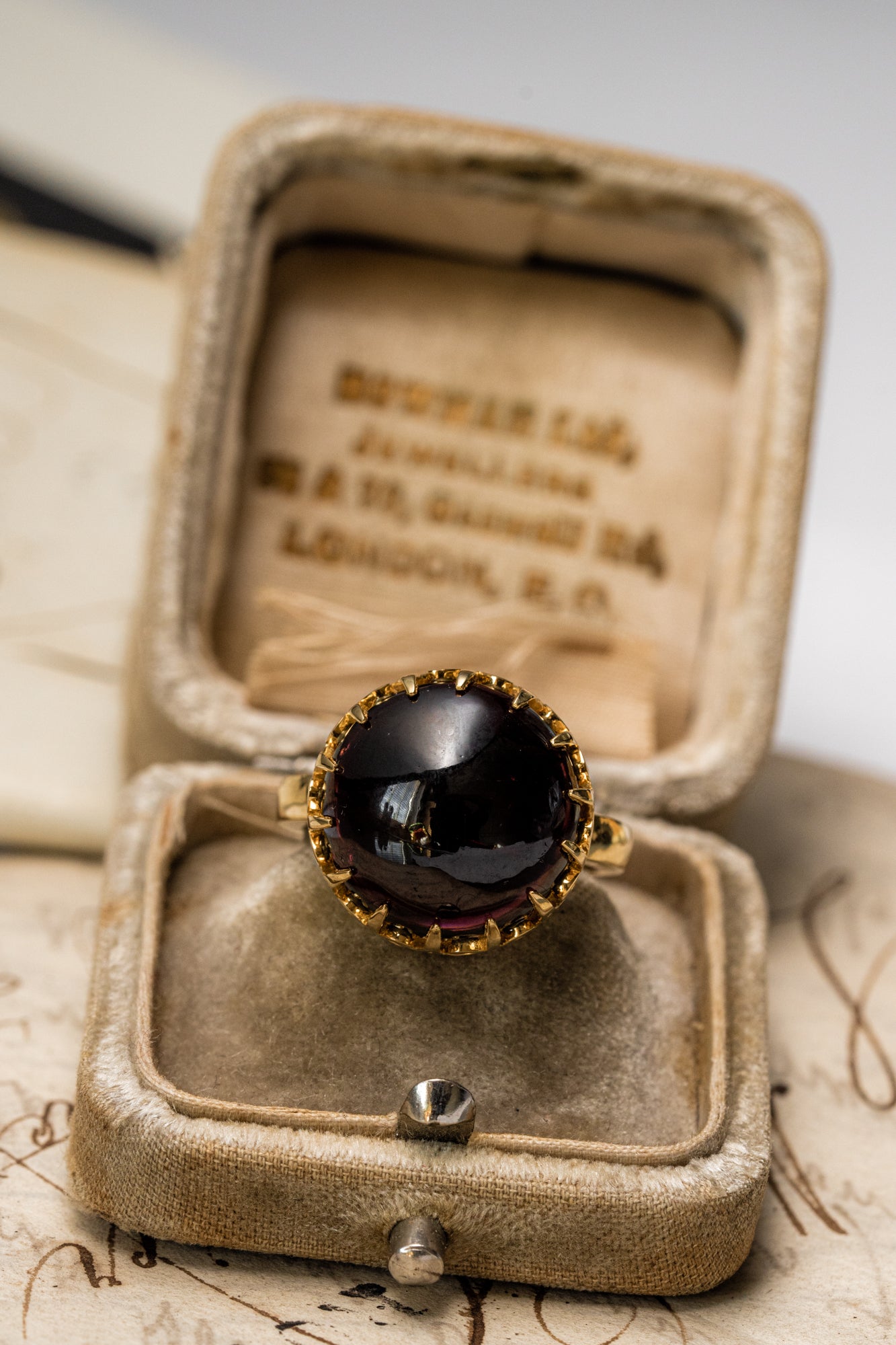 Unisex solid gold ring set with a garnet cabochon. A stunning revival of the 19th century jewelry designs and heavily inspired by oriental influence.  This ring is skuilfully hand-crafted by our goldsmith from recycled gold and ethically sourced garnet.