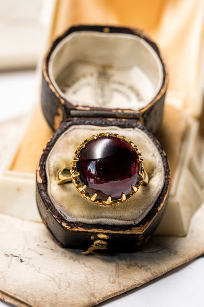 Unisex solid gold ring set with a garnet cabochon. A stunning revival of the 19th century jewelry designs and heavily inspired by oriental influence.  This ring is skuilfully hand-crafted by our goldsmith from recycled gold and ethically sourced garnet.