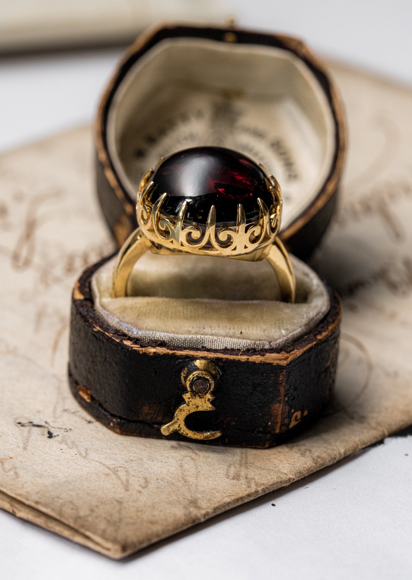 Unisex solid gold ring set with a garnet cabochon. A stunning revival of the 19th century jewelry designs and heavily inspired by oriental influence.  This ring is skuilfully hand-crafted by our goldsmith from recycled gold and ethically sourced garnet.