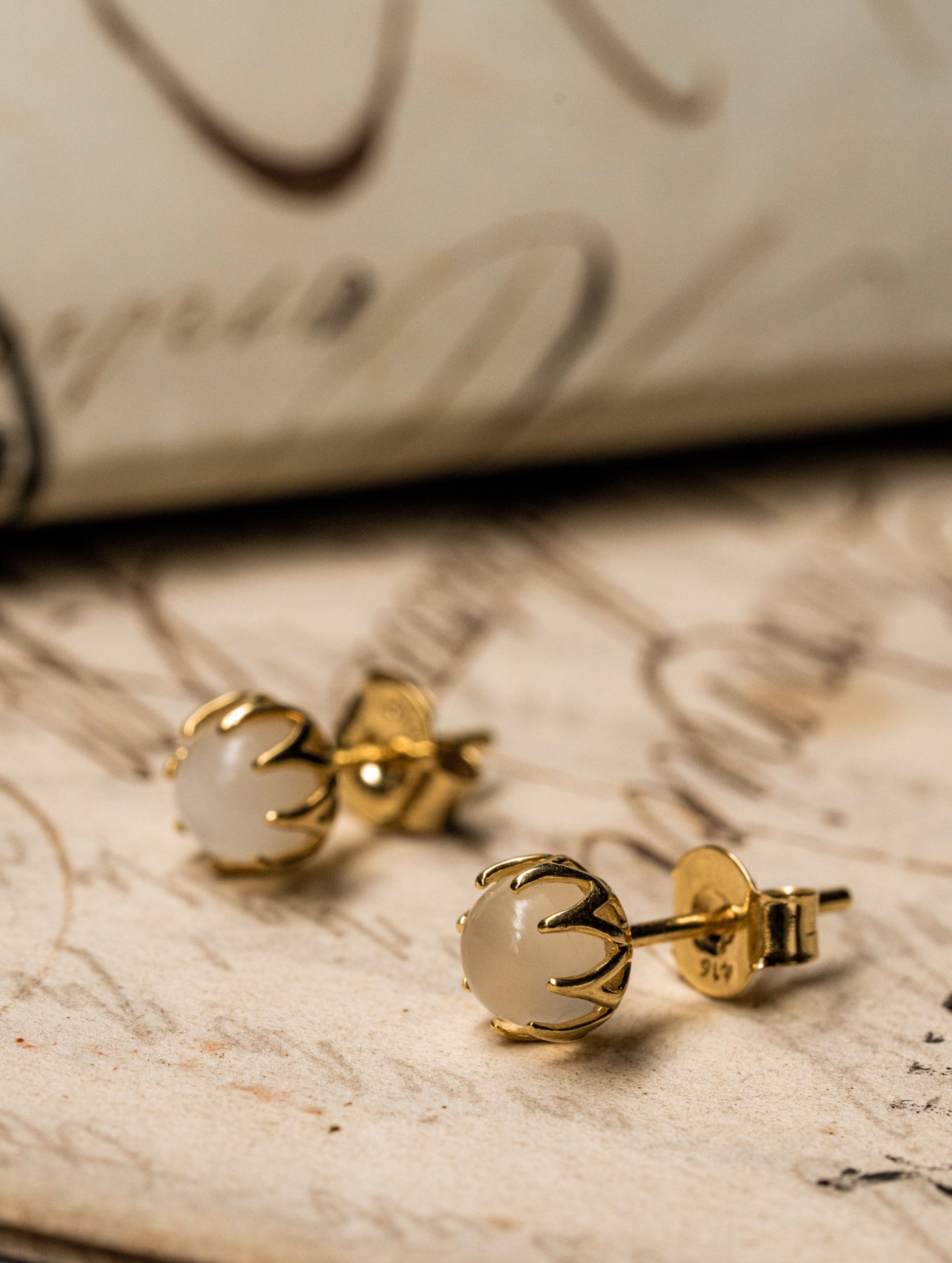 Shimmering and all-over lovely antique revival moonstone studs are designed by our goldsmiths. They are handmade of solid 10k yellow gold, these beautiful Ottoman style earrings are set with moonstone cabochons.