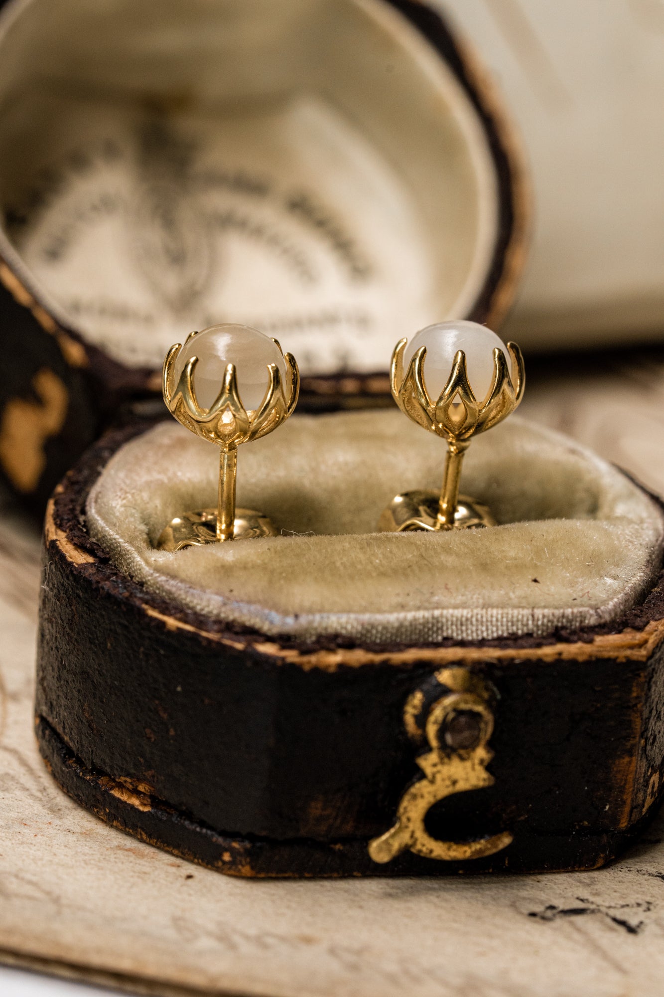 Shimmering and all-over lovely antique revival moonstone studs are designed by our goldsmiths. They are handmade of solid 10k yellow gold, these beautiful Ottoman style earrings are set with moonstone cabochons.