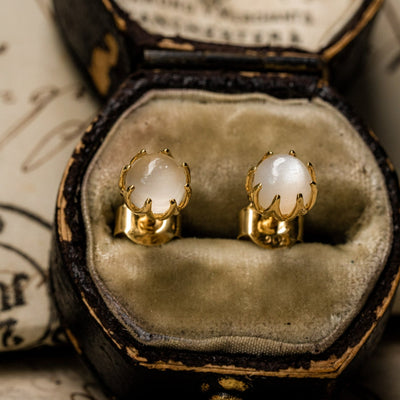 Shimmering and all-over lovely antique revival moonstone studs are designed by our goldsmiths. They are handmade of solid 10k yellow gold, these beautiful Ottoman style earrings are set with moonstone cabochons.