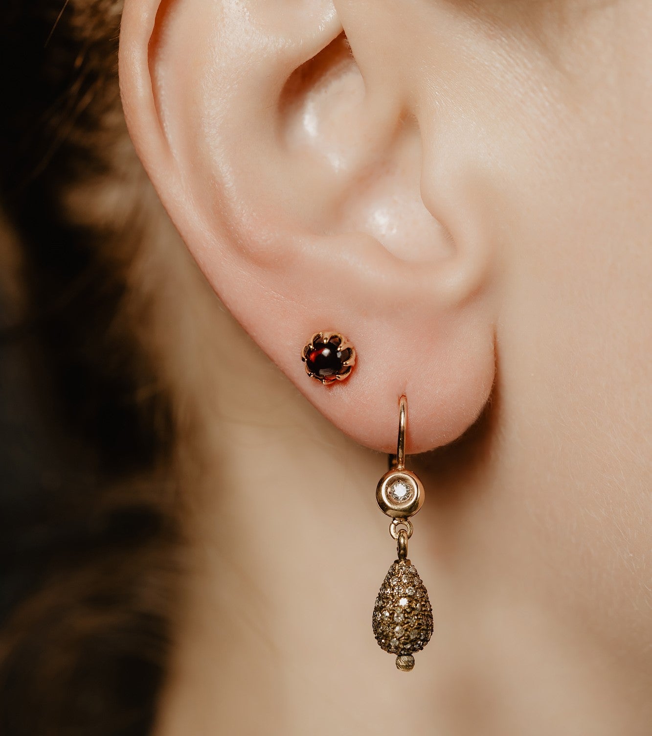 Mystic shimmer of deep-red garnet - these antique revival garnet cabochon studs are designed by our goldsmiths. Made of solid 10k yellow gold, these gold oriental style earrings are inspired by Ottoman architecture.