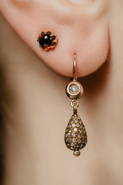 Mystic shimmer of deep-red garnet - these antique revival garnet cabochon studs are designed by our goldsmiths. Made of solid 10k yellow gold, these gold oriental style earrings are inspired by Ottoman architecture.