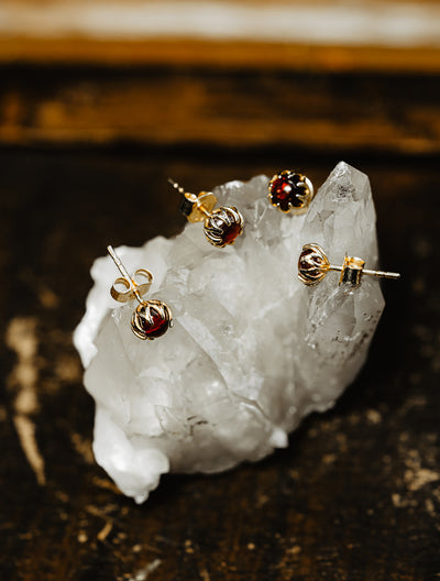 Mystic shimmer of deep-red garnet - these antique revival garnet cabochon studs are designed by our goldsmiths. Made of solid 10k yellow gold, these gold oriental style earrings are inspired by Ottoman architecture.