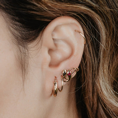 Victorian revival double headed snake studs. Made of solid rose or yellow gold with natural rubies and sapphires. Unique artisan stud earrings. Handmade of solid gold. Perfect gift idea for her! Journey Jewellery online design jewelry shop.