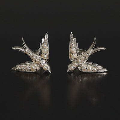 A perfect love token piece of jewelry! Romantic and very symbolic these antique revival studs are handmade by our goldsmiths. Made of solid 14k yellow gold or sterling silver, these beautiful antique style swallow earrings are set with natural pearls.