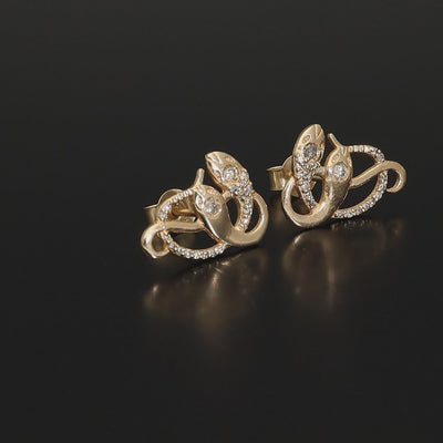 Inspired by the 19th century animal jewelry, these artisan solid gold snake studs are set with the natural mined diamonds.  Handmade with love and passion, these statement unisex earrings are made of solid 14 carat yellow gold and are set with 46 sparkling diamonds.  Here they come, your unorthodox diamond studs!