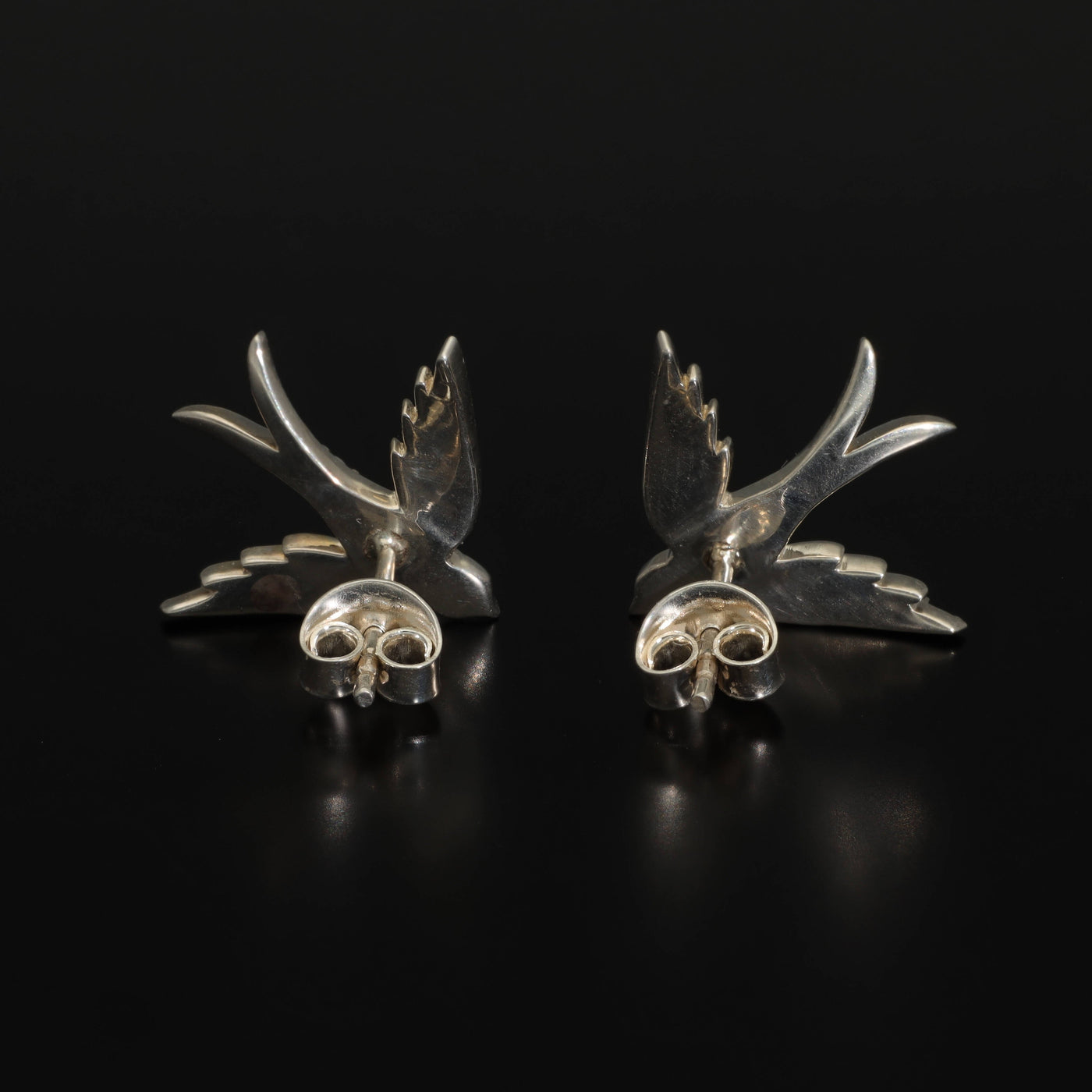 A perfect love token piece of jewelry! Romantic and very symbolic these antique revival studs are handmade by our goldsmiths. Made of solid 14k yellow gold or sterling silver, these beautiful antique style swallow earrings are set with natural pearls.