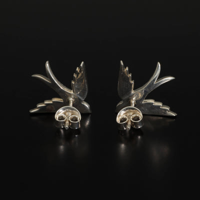 A perfect love token piece of jewelry! Romantic and very symbolic these antique revival studs are handmade by our goldsmiths. Made of solid 14k yellow gold or sterling silver, these beautiful antique style swallow earrings are set with natural pearls.