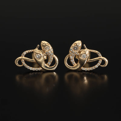 Inspired by the 19th century animal jewelry, these artisan solid gold snake studs are set with the natural mined diamonds.  Handmade with love and passion, these statement unisex earrings are made of solid 14 carat yellow gold and are set with 46 sparkling diamonds.  Here they come, your unorthodox diamond studs!