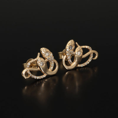 Inspired by the 19th century animal jewelry, these artisan solid gold snake studs are set with the natural mined diamonds.  Handmade with love and passion, these statement unisex earrings are made of solid 14 carat yellow gold and are set with 46 sparkling diamonds.  Here they come, your unorthodox diamond studs!