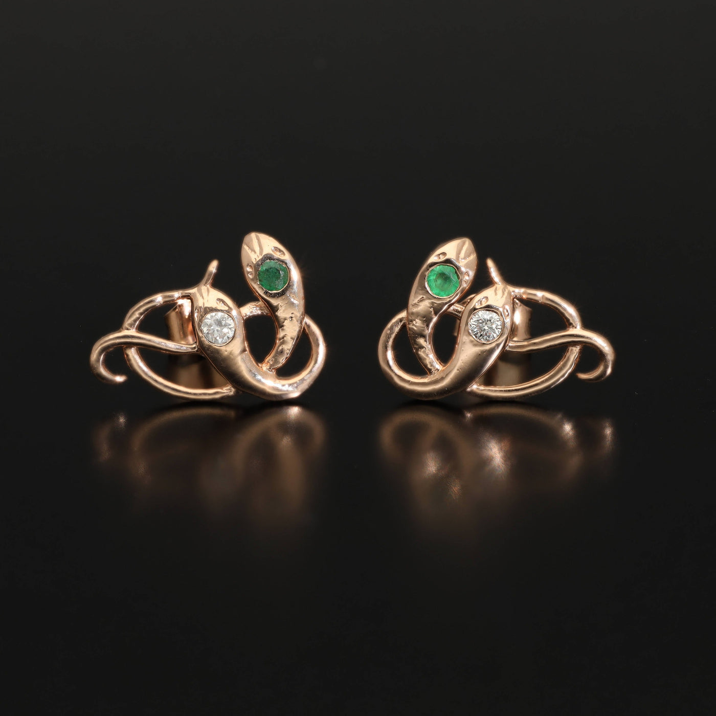 Inspired by the 19th century animal jewelry, these artisan solid gold snake studs are set with the natural precious stones.  Handmade with love and passion, these statement unisex earrings are made of solid 14 carat rose gold and are set with mined natural diamonds and emeralds.  A piece of history to mix-and-match with your ear candies!