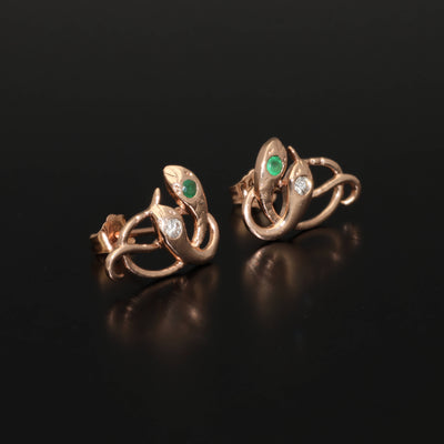 Inspired by the 19th century animal jewelry, these artisan solid gold snake studs are set with the natural precious stones.  Handmade with love and passion, these statement unisex earrings are made of solid 14 carat rose gold and are set with mined natural diamonds and emeralds.  A piece of history to mix-and-match with your ear candies!