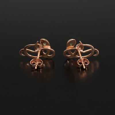 Inspired by the 19th century animal jewelry, these artisan solid gold snake studs are set with the natural precious stones.  Handmade with love and passion, these statement unisex earrings are made of solid 14 carat rose gold and are set with mined natural diamonds and emeralds.  A piece of history to mix-and-match with your ear candies!