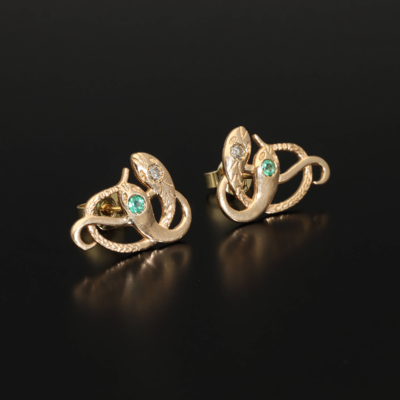 Inspired by the 19th century animal jewelry, these artisan solid gold snake studs are set with the natural precious stones.  Handmade with care, these statement unisex earrings are made of solid 14 carat yellow gold and are set with mined natural diamonds and emeralds.  A piece of history to mix-and-match with your ear candies!