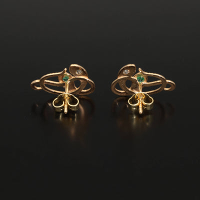 Inspired by the 19th century animal jewelry, these artisan solid gold snake studs are set with the natural precious stones.  Handmade with care, these statement unisex earrings are made of solid 14 carat yellow gold and are set with mined natural diamonds and emeralds.  A piece of history to mix-and-match with your ear candies!