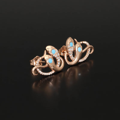 Inspired by the 19th century animal jewelry, these artisan solid gold snake studs are set with the natural precious stones.  Handmade with care, these statement unisex earrings are made of solid 14 carat yellow gold and are set with mined natural diamonds and turquoise.