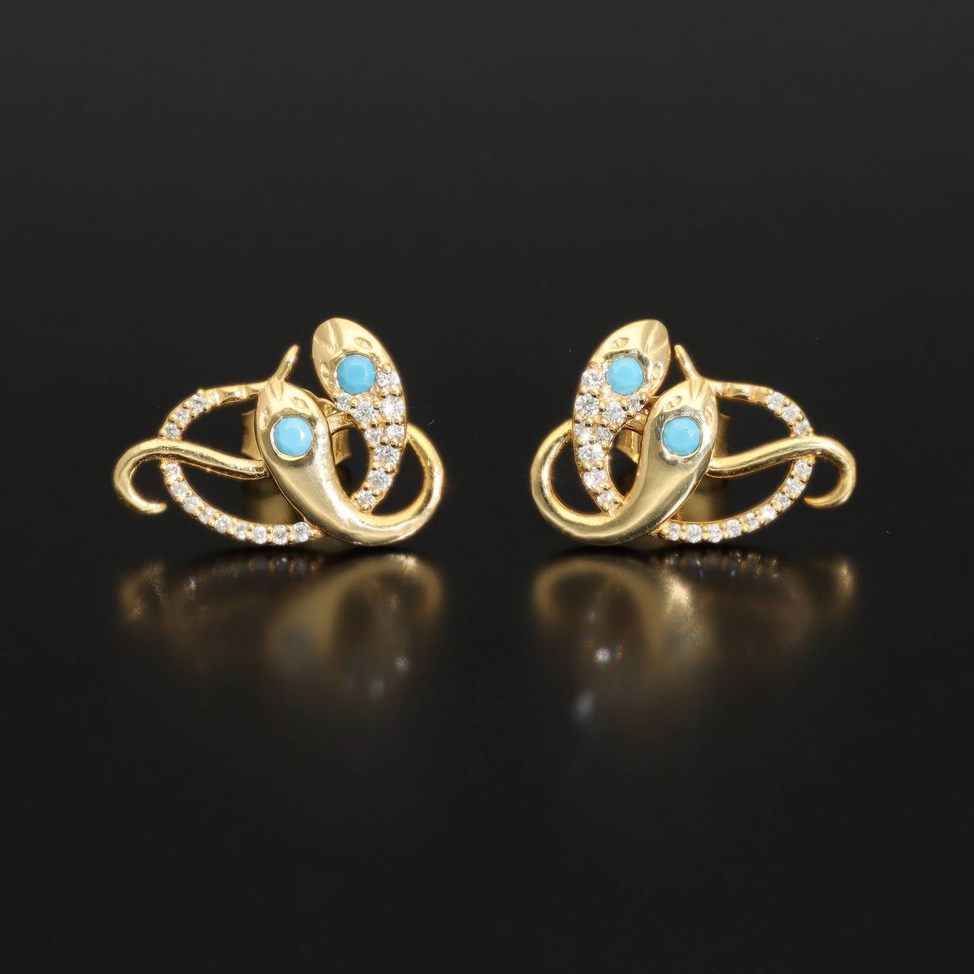 Inspired by the 19th century animal jewelry, these artisan solid gold snake studs are set with the natural precious stones.  Handmade with care, these statement unisex earrings are made of solid 14 carat yellow gold and are set with mined natural diamonds and turquoise.