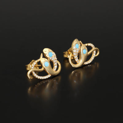 Inspired by the 19th century animal jewelry, these artisan solid gold snake studs are set with the natural precious stones.  Handmade with care, these statement unisex earrings are made of solid 14 carat yellow gold and are set with mined natural diamonds and turquoise.