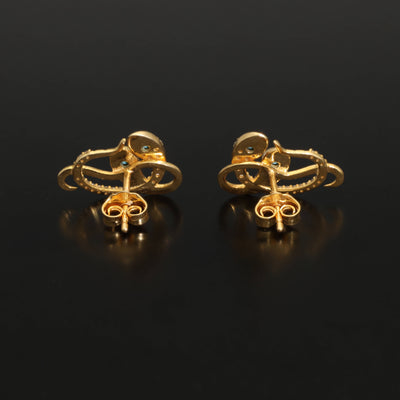 Inspired by the 19th century animal jewelry, these artisan solid gold snake studs are set with the natural precious stones.  Handmade with care, these statement unisex earrings are made of solid 14 carat yellow gold and are set with mined natural diamonds and turquoise.