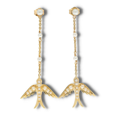 A perfect love token piece of jewelry! Romantic and very symbolic these antique revival drop earrings are handmade by our goldsmiths. Made of solid 10k yellow gold, these beautiful Victorian style swallow earrings are set with natural pearls.