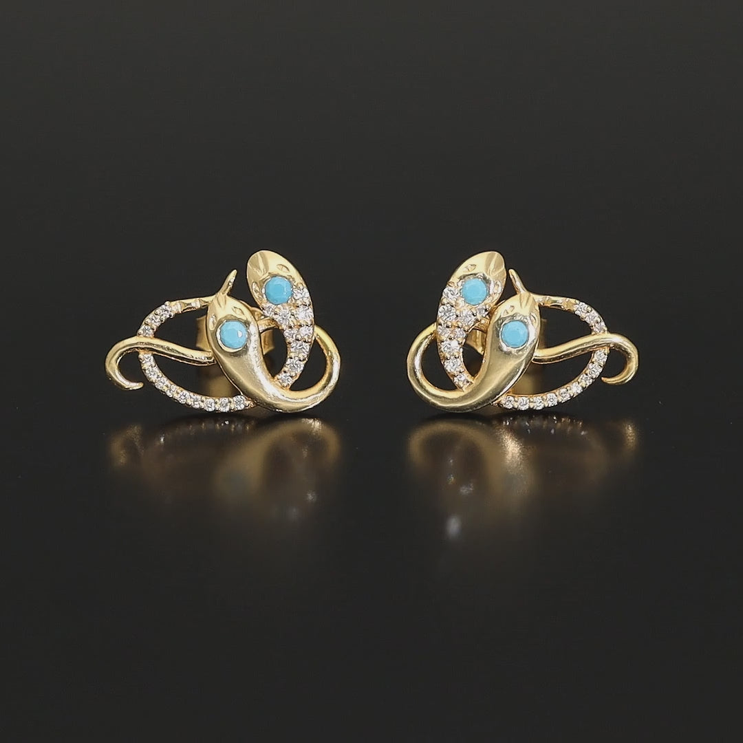 Inspired by the 19th century animal jewelry, these artisan solid gold snake studs are set with the natural precious stones.  Handmade with care, these statement unisex earrings are made of solid 14 carat yellow gold and are set with mined natural diamonds and turquoise.