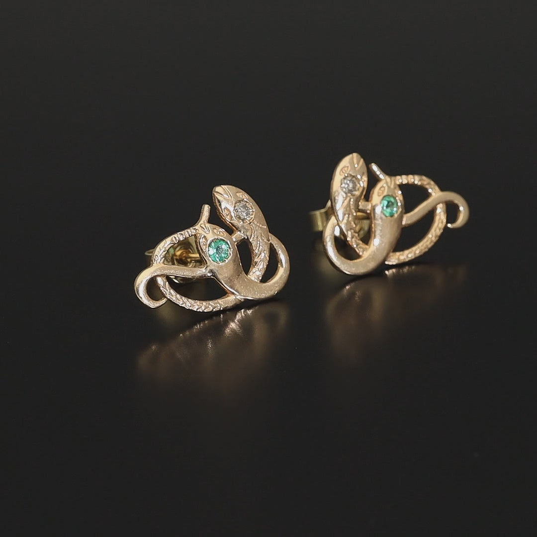 Inspired by the 19th century animal jewelry, these artisan solid gold snake studs are set with the natural precious stones.  Handmade with care, these statement unisex earrings are made of solid 14 carat yellow gold and are set with mined natural diamonds and emeralds.  A piece of history to mix-and-match with your ear candies!